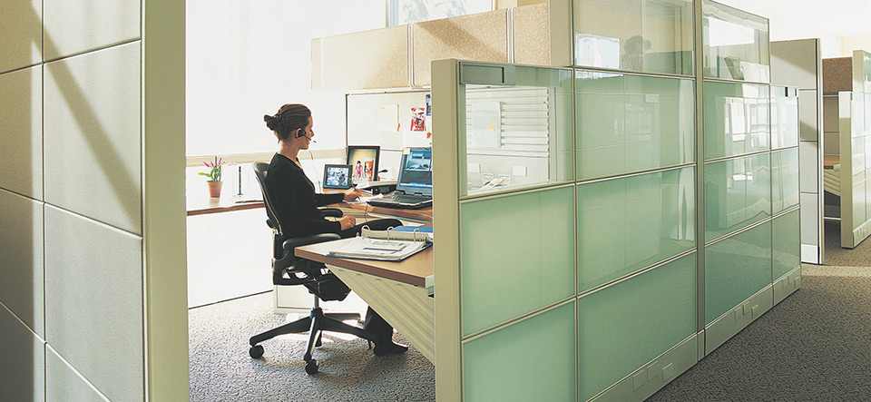 Woman working in an office cubicle