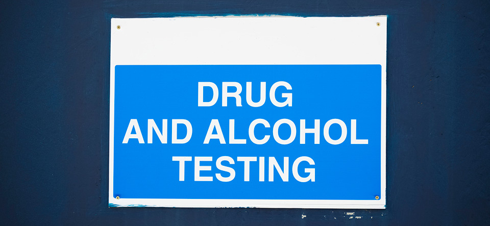 Drug and alcohol testing sign at work for staff